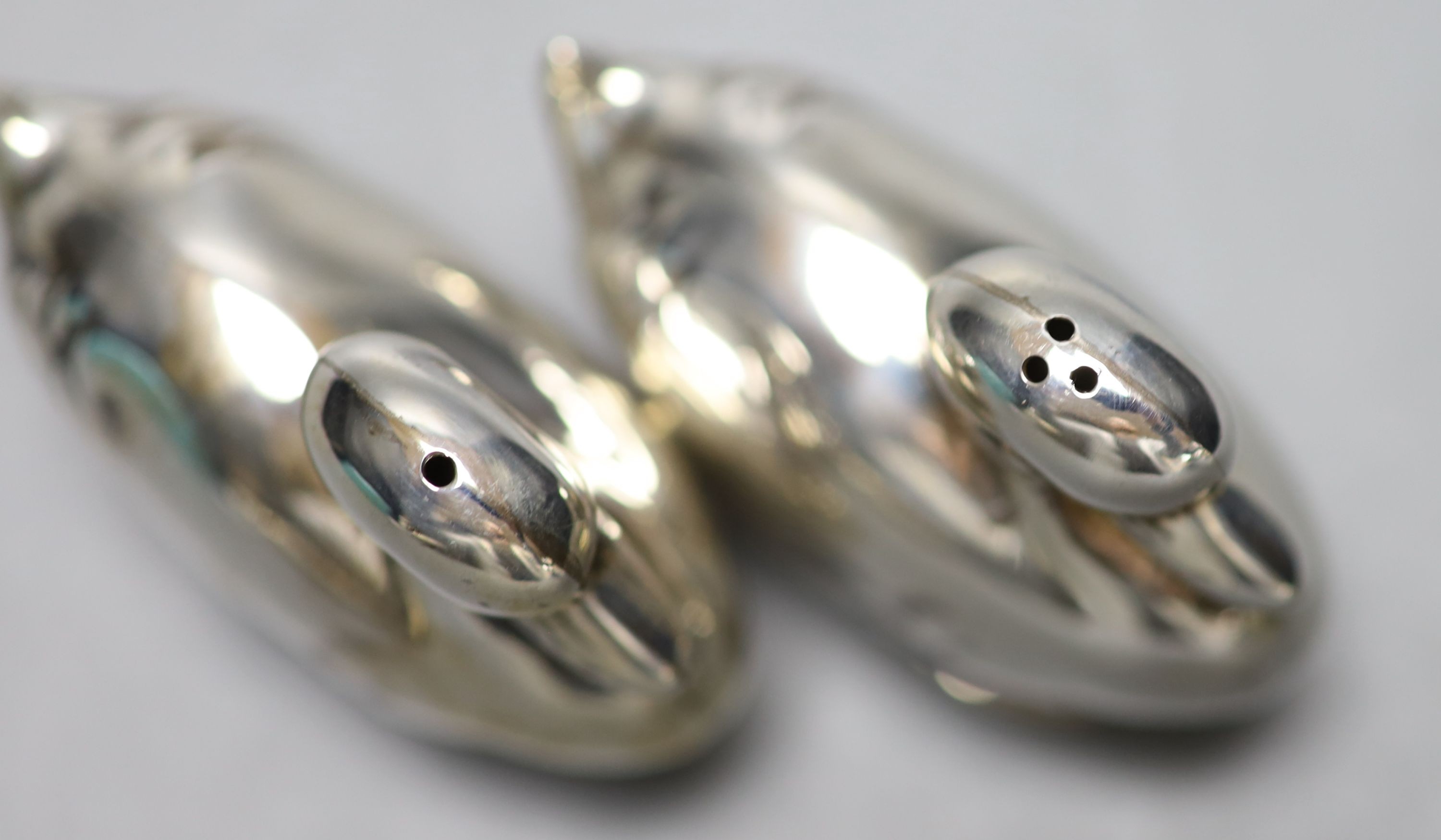 A modern pair of Tiffany & Co novelty silver condiments, modelled as a pair of ducks, height 4cm, with original box etc. import marks for London, 1990.